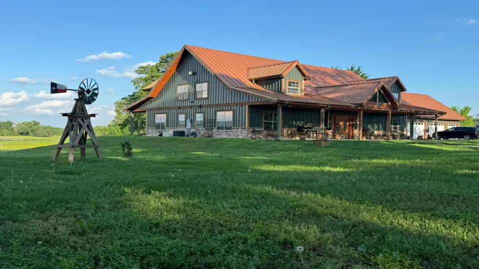 Texas ranch house with a metal roof and a decorative windm, 40 acres in Red River County, 40.00 acres in Red River County, TX