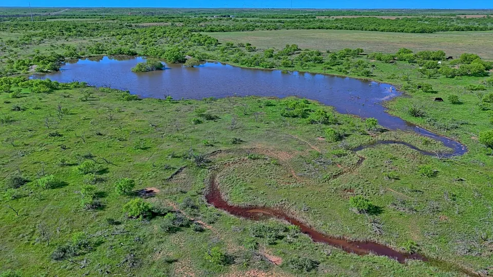 Stock pond with small island and winding creek bed on green, g, 162 acres in Baylor County, 162.80 acres in Baylor County, TX