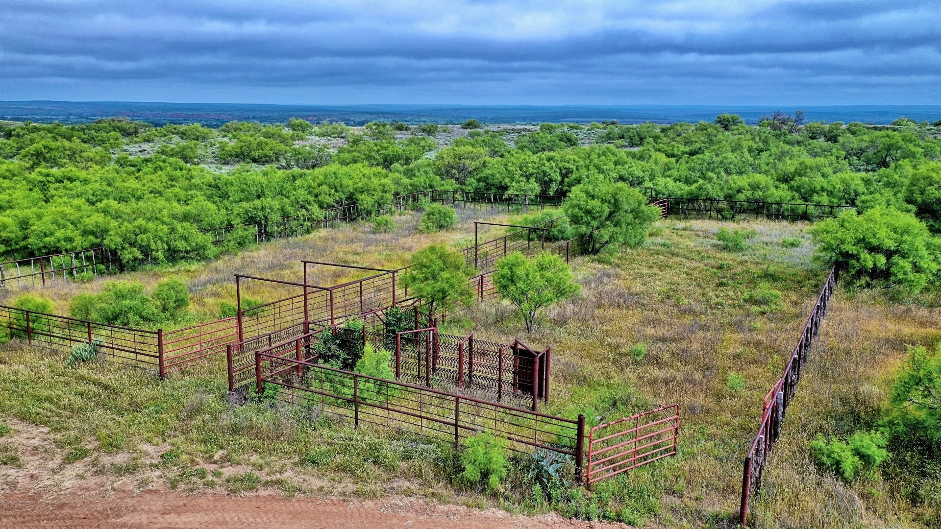Fenced livestock pens and pastures on a working ranch, 1,925 acres in Collingsworth County, TX