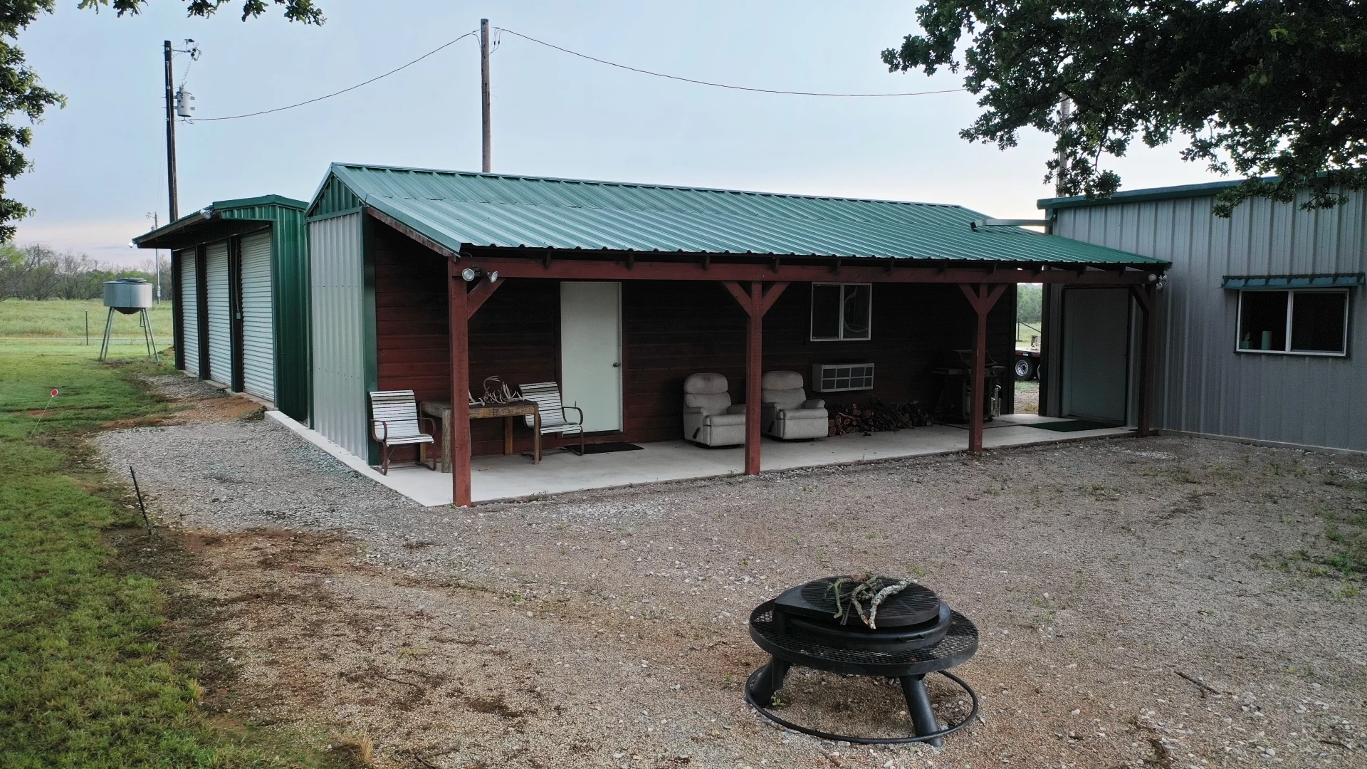 Ranch cabin, shop and covered porch in North Texas